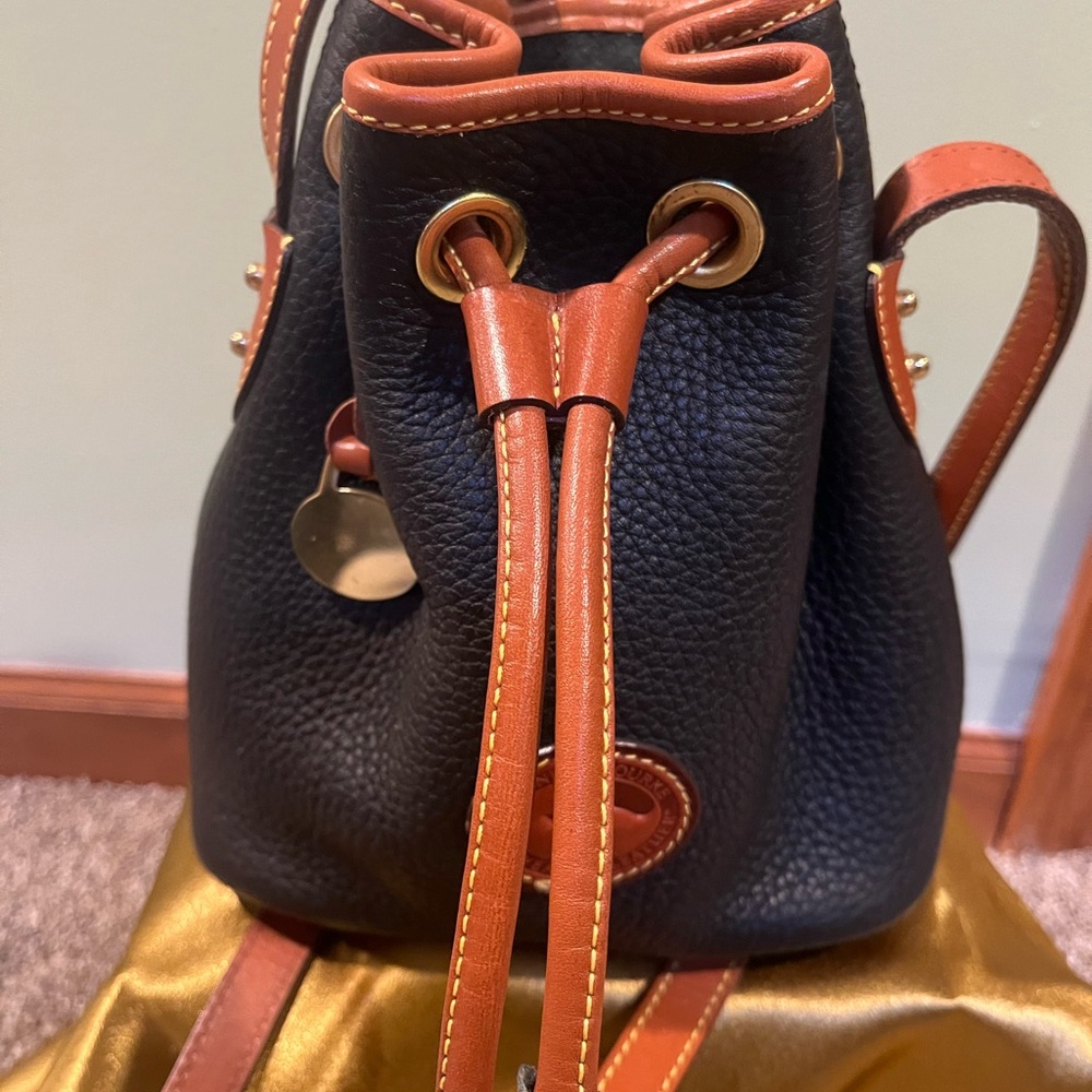 Dooney and Bourke Vintage Black and Tan Leather Bucket Bag
